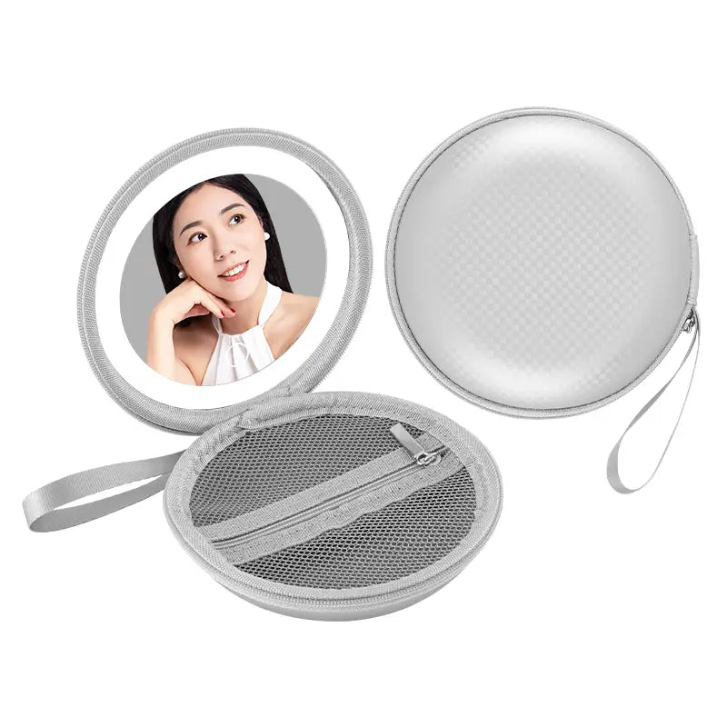 Silver circular compact mirror with built-in led light and mesh-lined interior compartments inside a blue and silver round bag mirror case designed for round bag blue use.