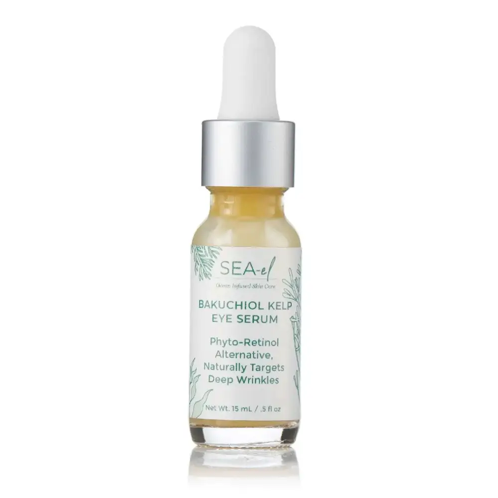 Sea-elf bakuchiol kelp eye serum in clear glass bottle with silver dropper cap containing pale yellow liquid for wrinkles and glow