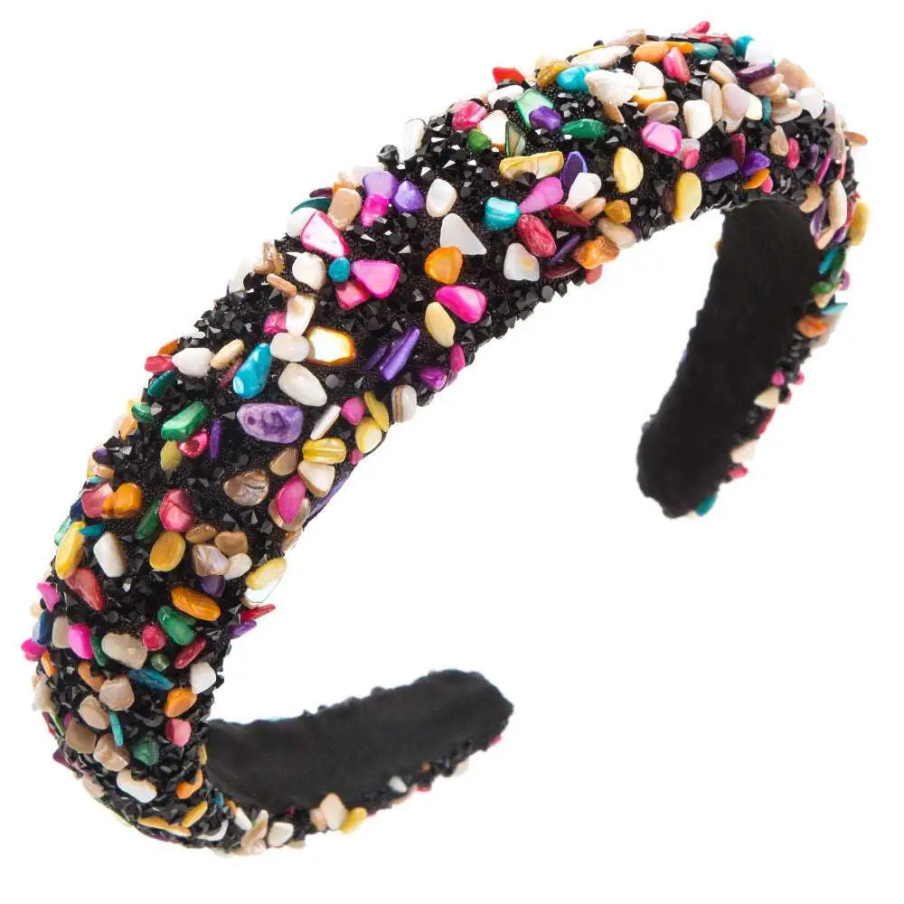 A black baroque colorful headband design adorned with multicolored shell fragments and sparkling gemstones