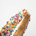 A baroque colorful headband with vibrant beads design adorned with sparkling gemstones and metallic accents
