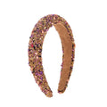 Baroque colorful headband design adorned with glittering gold and pink beads and sparkling gemstones with suede interior