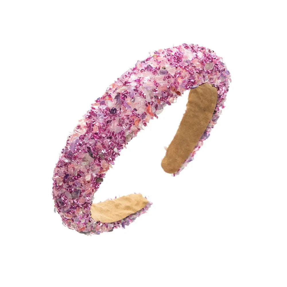 Baroque colorful headband adorned with sparkling gemstones in pink and purple crystals with tan interior lining