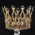 A baroque golden birthday crown cake decoration featuring a golden tiara with intricate filigree detailing and clear crystals