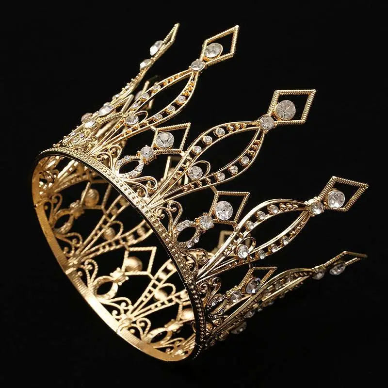 A baroque golden birthday crown cake decoration featuring a golden tiara with intricate filigree detailing and clear crystals
