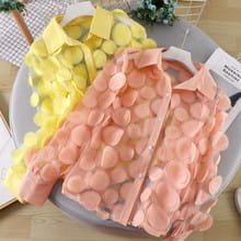 a soft peach-colored flower chiffon gauzy blouse with bubble texture, classic collar, and button-front design