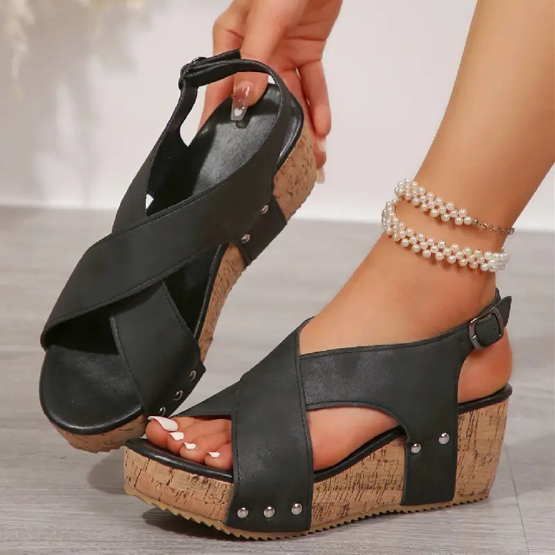 black cross-strap rivet wedges snadals with cork soles featuring silver studs and fish mouth design in beige suede material