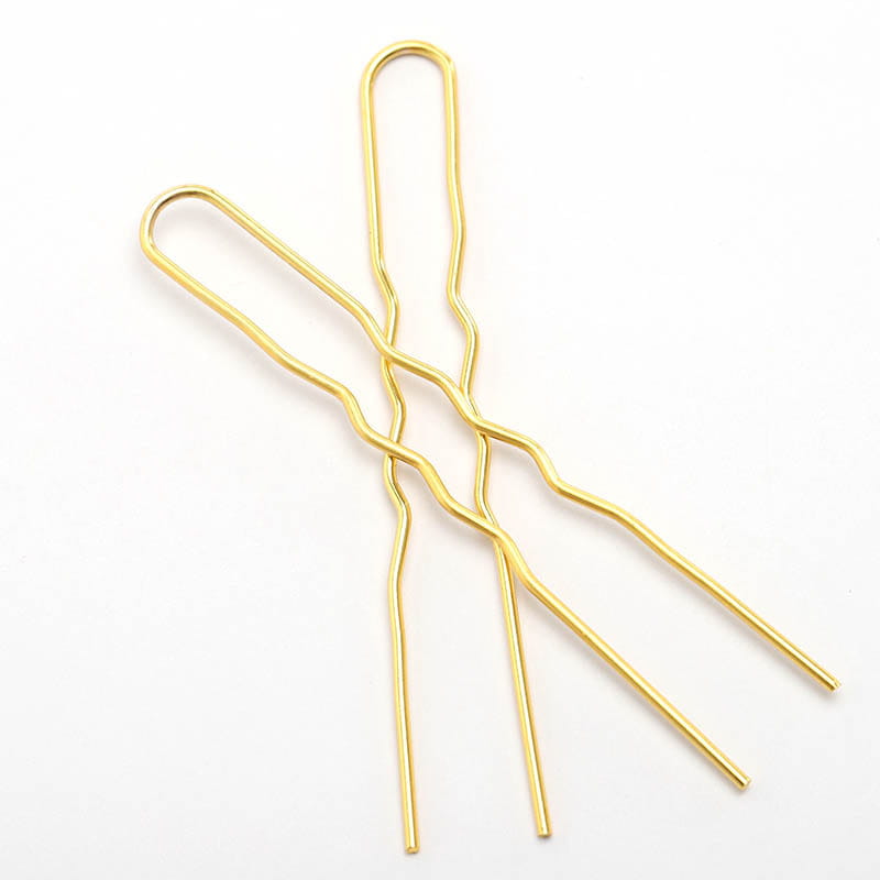 gold-colored twisted wire hairpins with a sleek metallic finish as diy hair accessories material for styling and crafting hair accessories