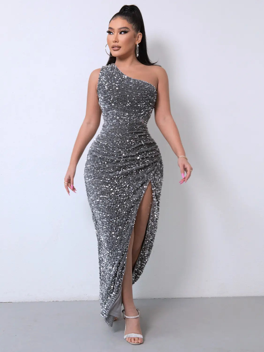 a shimmering silver sequined one-shoulder gown with a high slit and ruched bodice featuring a shoulder slash neck design ideal for foreign trade sleeveless occasions and slash neck sequins style events