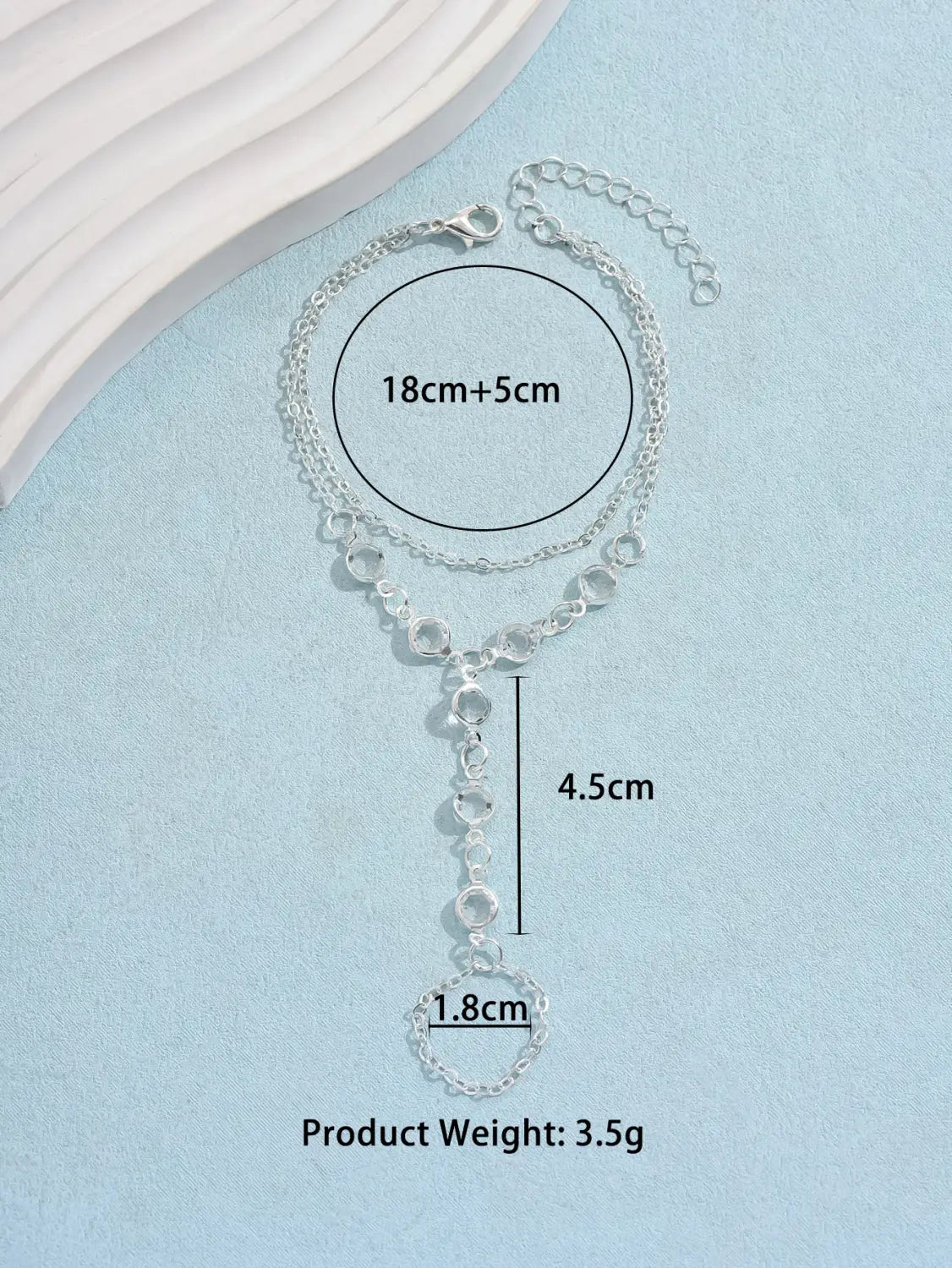 Silver crystal fashion minimalist bracelet ring featuring a silver chain anklet with a delicate heart-shaped pendant and interlocking circular links, ideal for american fashion minimalist style.