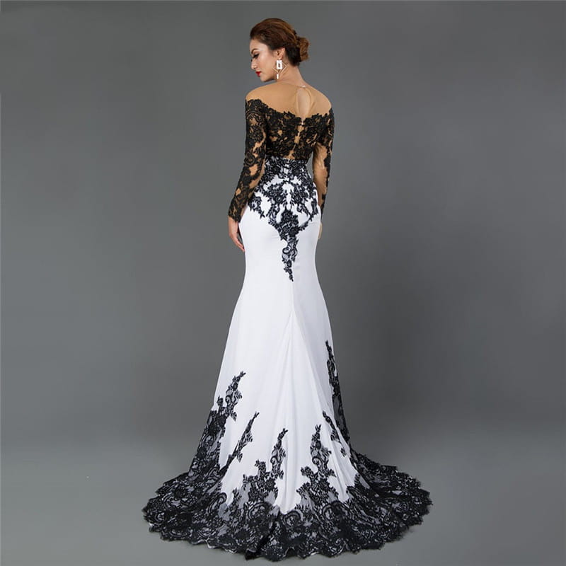 Elegant white off-the-shoulder embroidered lace maxi fishtail slim tail gown with intricate black lace detailing on the bodice sleeves and hem.
