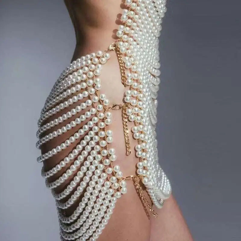 Back view of a shimmering white beaded halter fashion pearl chain dress with cascading pearls for fashion party banquet