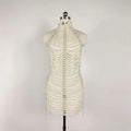 A shimmering white beaded halter fashion party pearl chain dress with cascading pearls and metallic accents