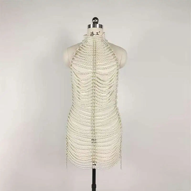 A shimmering white beaded halter fashion party pearl chain dress with cascading pearls and metallic accents