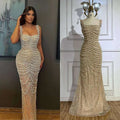 A shimmering champagne-colored beaded nude elegant sling luxury gown featuring intricate cascading pearls and sequins