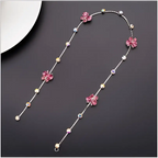 Beaded pink floral wedding hair accessories featuring a delicate silver chain with clear crystal accents