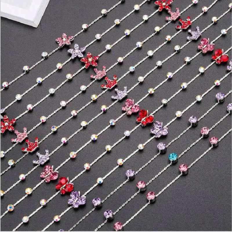 Beaded pink floral wedding hair accessories featuring a delicate silver chain with sparkling pink and red floral charms