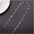 Beaded pink floral wedding hair accessories featuring a delicate silver chain with pink unicorn charms and clear crystals