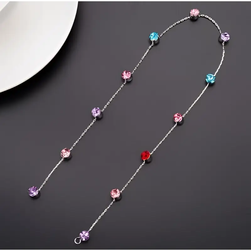 Delicate silver chain wedding hair accessories with beaded pink floral design and colorful faceted gemstones