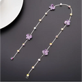Beaded pink floral wedding hair accessories featuring a delicate silver chain with purple butterfly charms and pearls