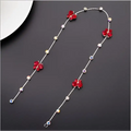 Beaded pink floral wedding hair accessories featuring a delicate silver chain with red floral charms and pearls