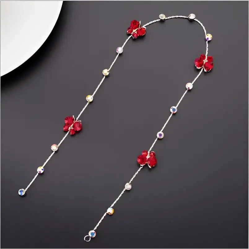 Beaded pink floral wedding hair accessories featuring a delicate silver chain with red floral charms and pearls