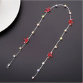 Beaded pink floral wedding hair accessories featuring a delicate silver chain with red enamel cherub charms and clear crystals