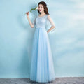 A delicate light blue lace and tulle banquet evening dress with sheer short sleeves and beaded white tulle details