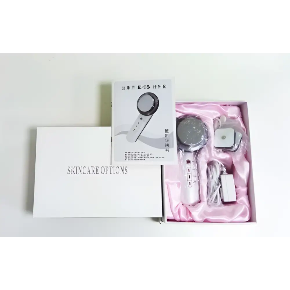 Silver and white beauty care slimming device handheld ultrasound massager with sleek modern design for facial use