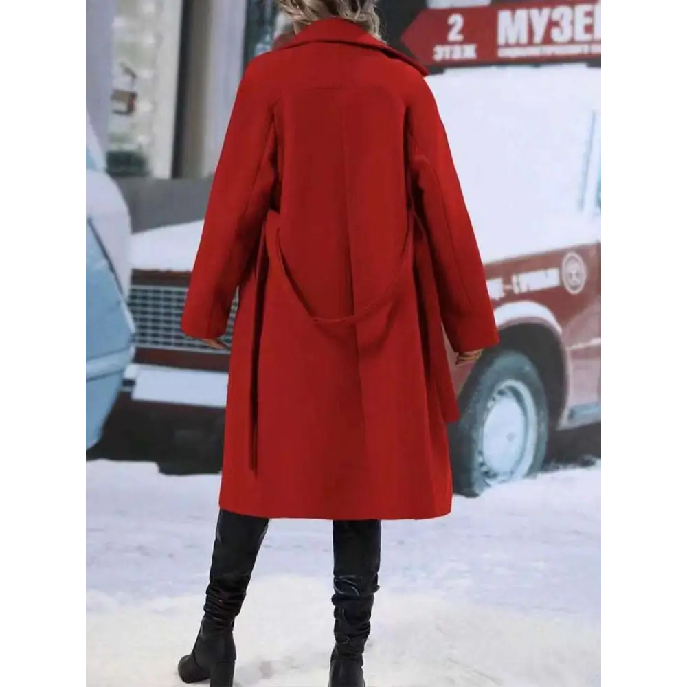 A vibrant red longline wool coat with classic double breasted design and wide collar in contrast to beige double breasted trench coat belt winter fashion trends