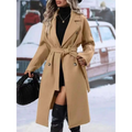 Beige double breasted trench coat with belted waist and gold toned buttons for stylish belt winter fashion wear