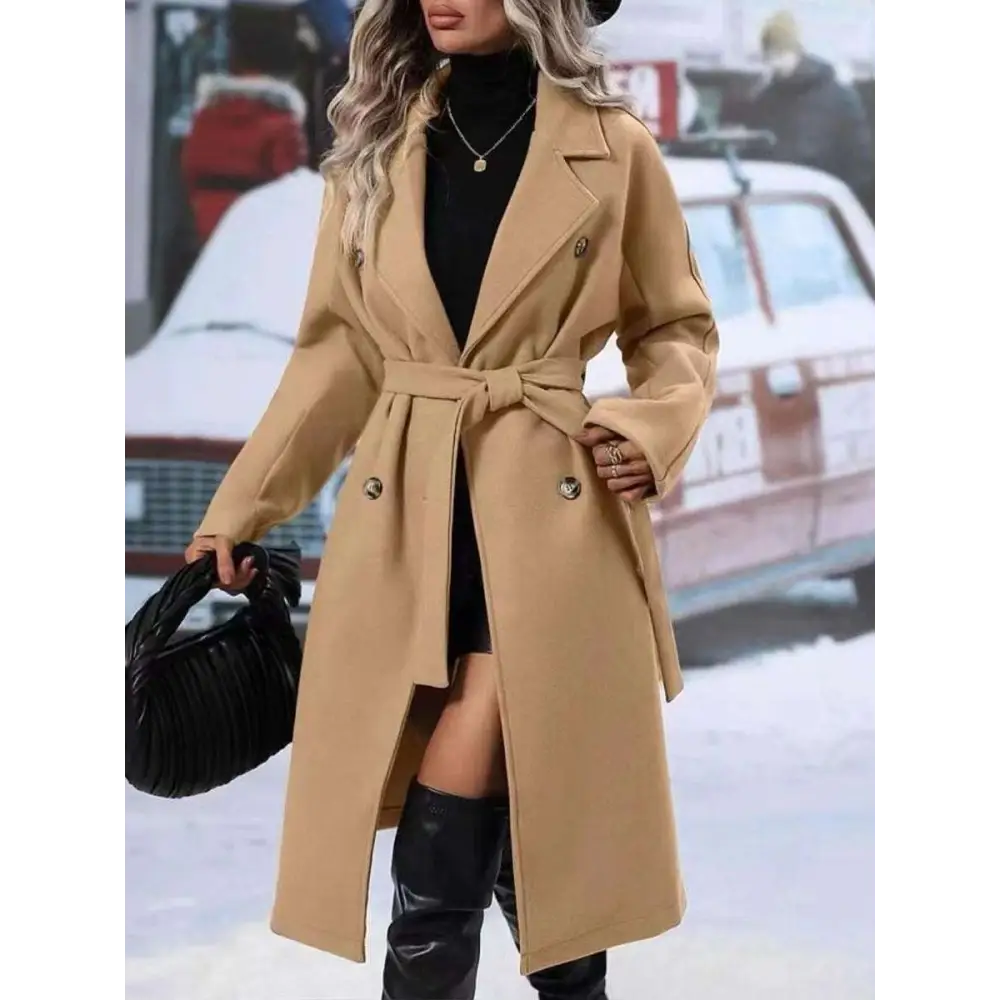 Beige double breasted trench coat with belted waist and gold toned buttons for stylish belt winter fashion wear