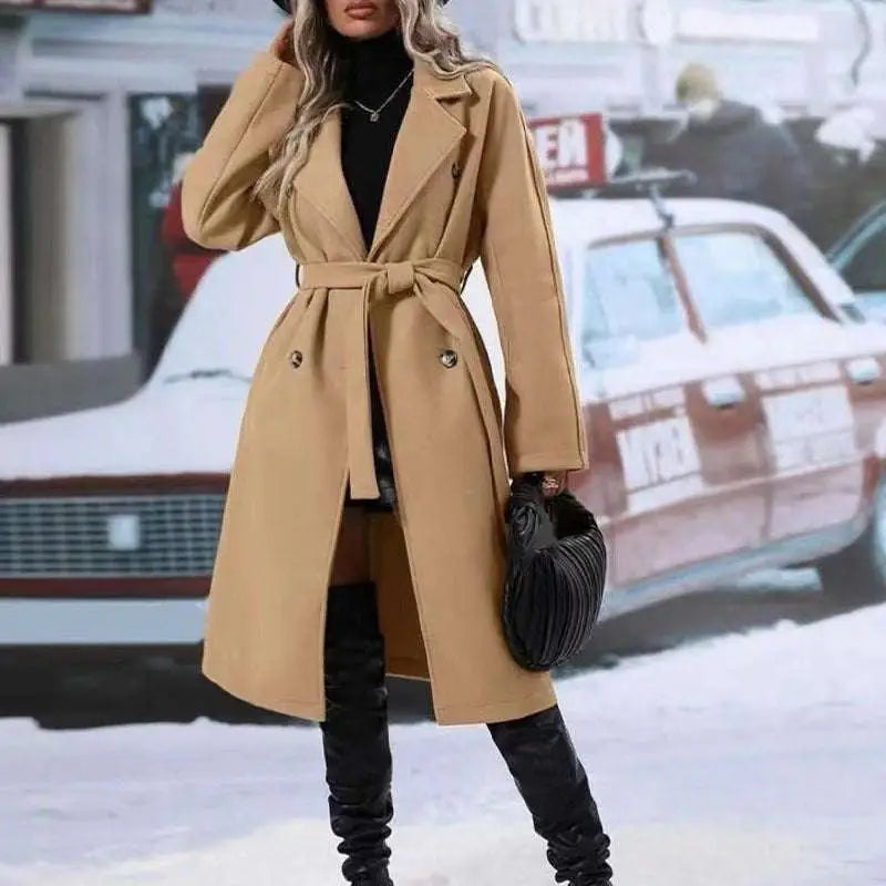 Beige double breasted trench coat with belted waist designed for winter fashion and stylish outerwear use