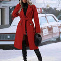 A vibrant red belted trench coat with gold buttons and classic double breasted design for belt winter fashion