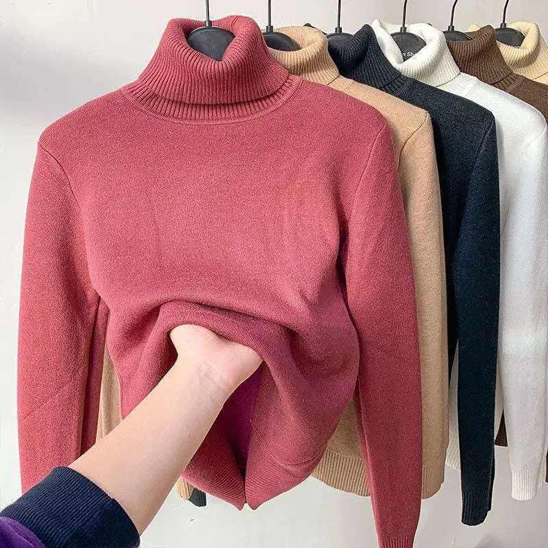 A soft fleece turtle neck winter sweater in beige with ribbed knit fabric and a snug turtleneck collar winter pullover