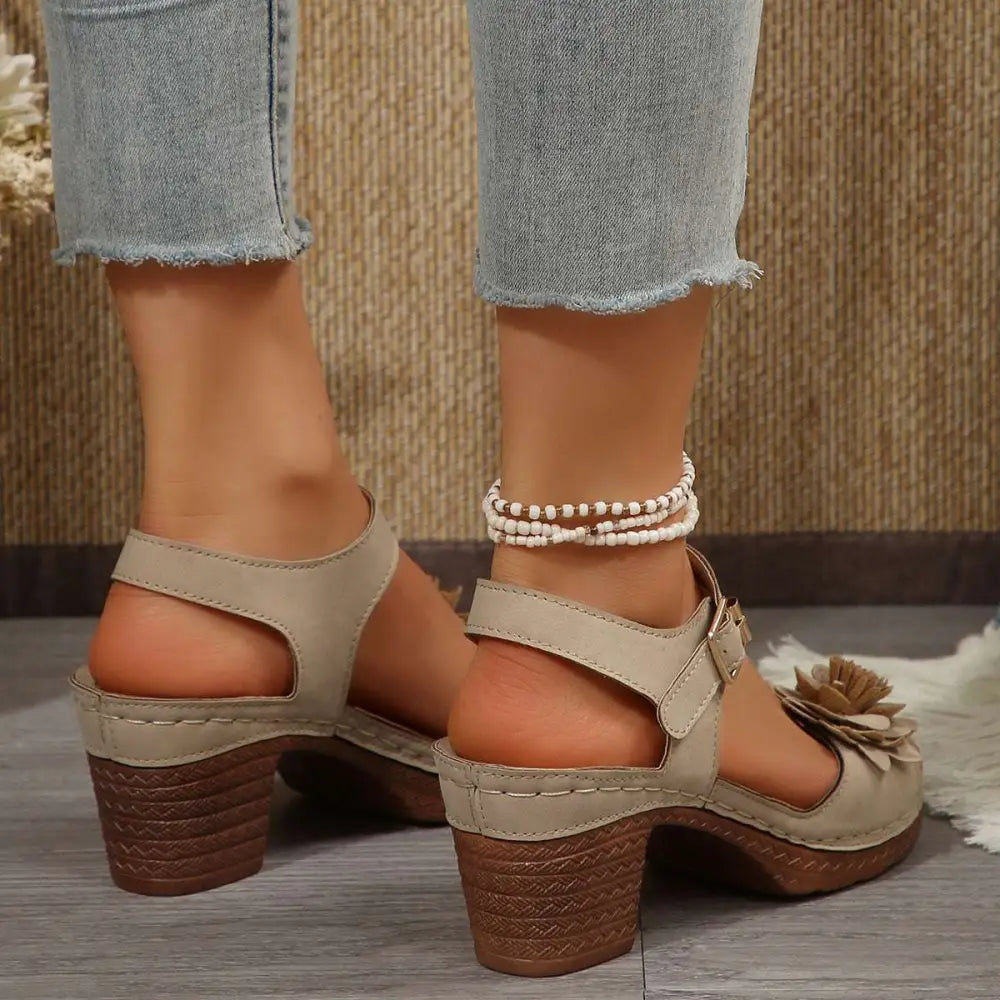 Beige floral flowers chunky heel sandals in suede with woven brown heel and decorative flower detail on the toe