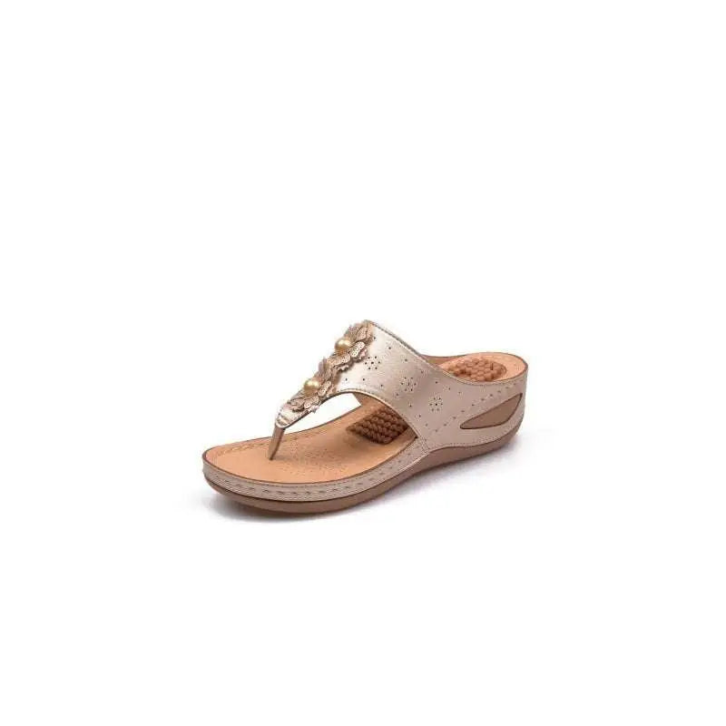 Beige floral large leather thong massage sandals with decorative pearl floral embellishments and perforated detailing