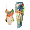 Beige floral one piece swimsuit with vibrant tropical print paired with matching sarong bathing skirt and blue tie belt