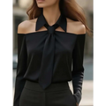 Black satin off-the-shoulder blouse with strap lapel design and prominent tied bow at the neckline