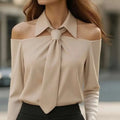 Beige off-the-shoulder blouse with halter neck strap and strap lapel design featuring a structured collar and tied bow