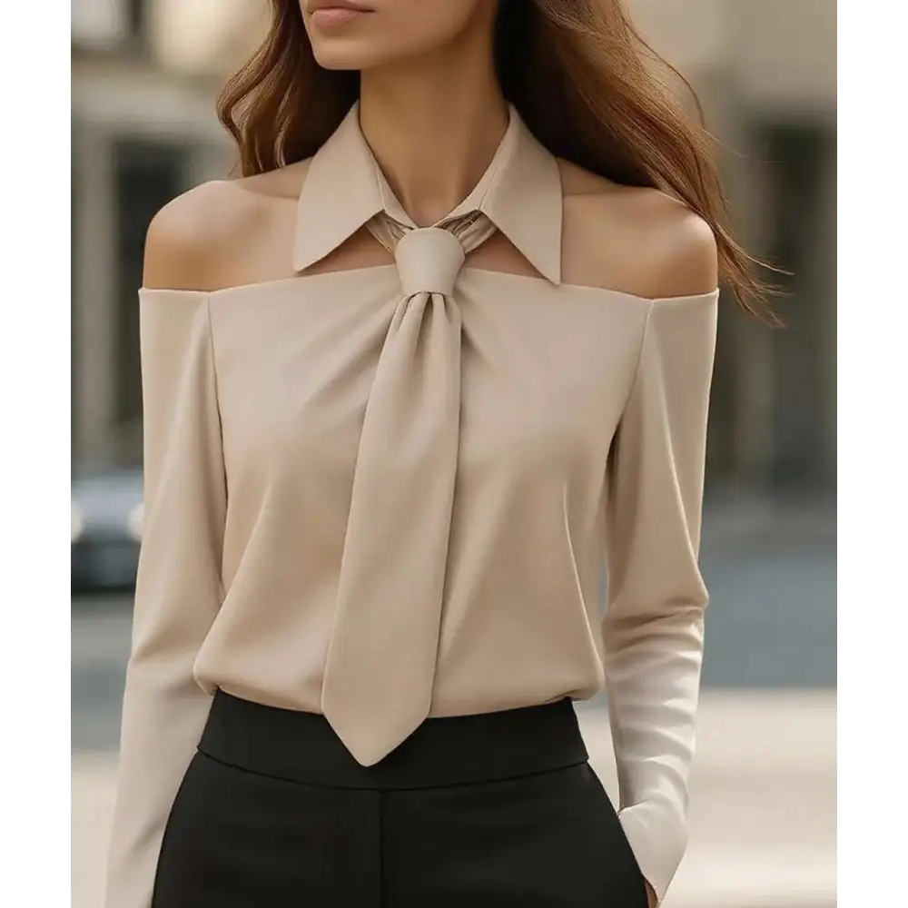 Beige off-the-shoulder blouse with halter neck strap and strap lapel design featuring a structured collar and tied bow