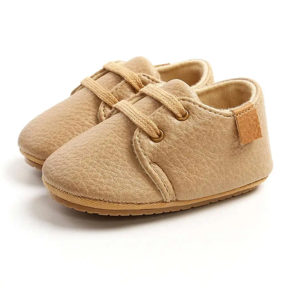 Beige leather baby casual shoes with matching laces and soft rubber sole ideal for women baby shoes use