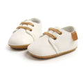 Beige leather baby casual shoes with white leather upper and tan laces and sole for baby casual shoes