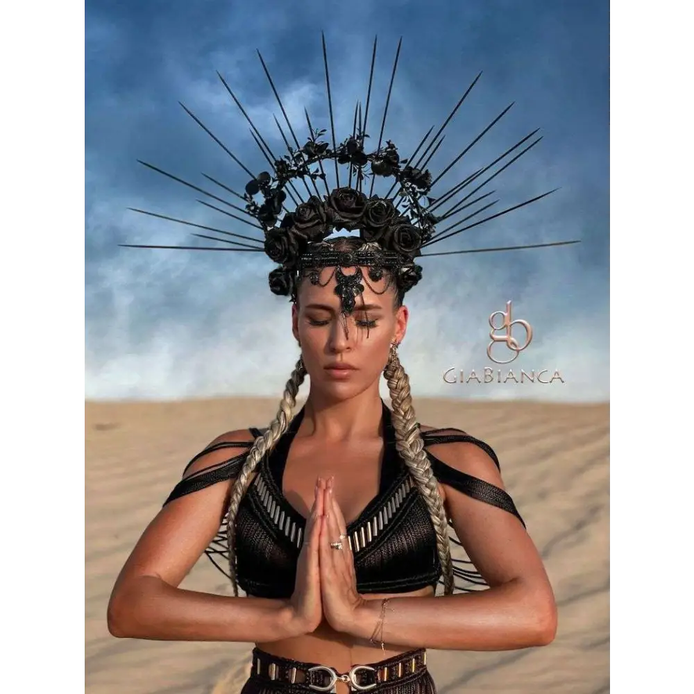 Black spiked crown with roses and intricate metalwork styled with beige macramé tassel dress creative beach travel set