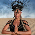Black ornate headpiece with roses and spikes paired with beige macramé tassel dress creative beach travel set