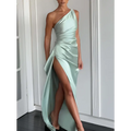 A sleek mint green satin one-shoulder backless slit gown with draped bodice and high slit detailing