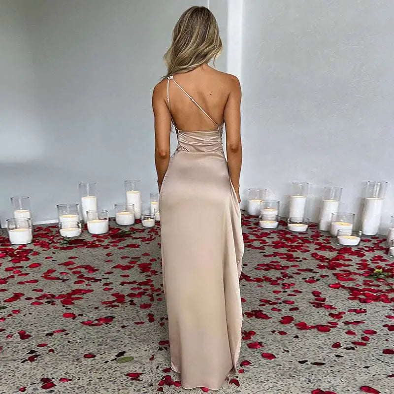 Beige one-shoulder backless slit satin gown with a shimmering draped bodice and high slit design