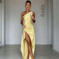 A sleek yellow satin one-shoulder backless slit gown with draped bodice and high slit design