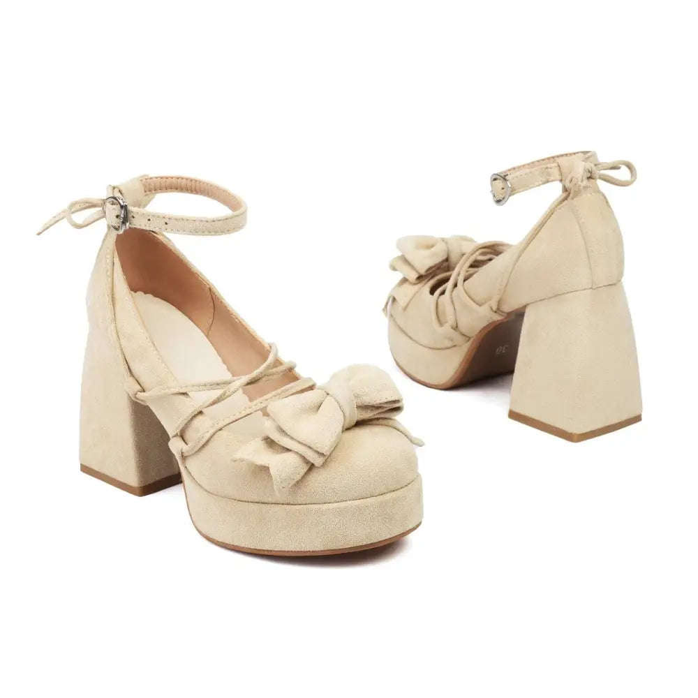 Beige suede platform lolita heels with ankle strap and small bow on the toe for elegant wear