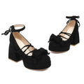 Beige suede platform lolita heels with ankle straps and small decorative bows in front view
