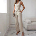 Beige sleeveless jumpsuit with button-front bodice and wide-leg trousers in a pleated casual vest suit design